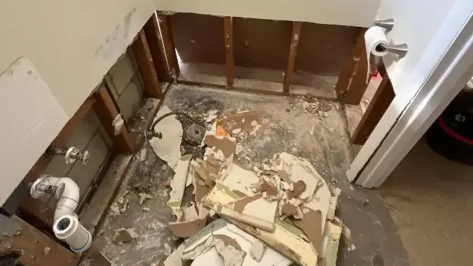 Bathroom stripped to the studs after a sewage backup cleanup
